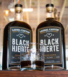 Black Hjerte (heart) liqueur bottles with glass